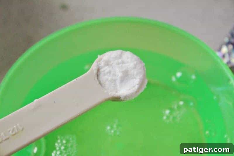 Step 3: Mixing glue, water, and baking soda thoroughly in a bowl.