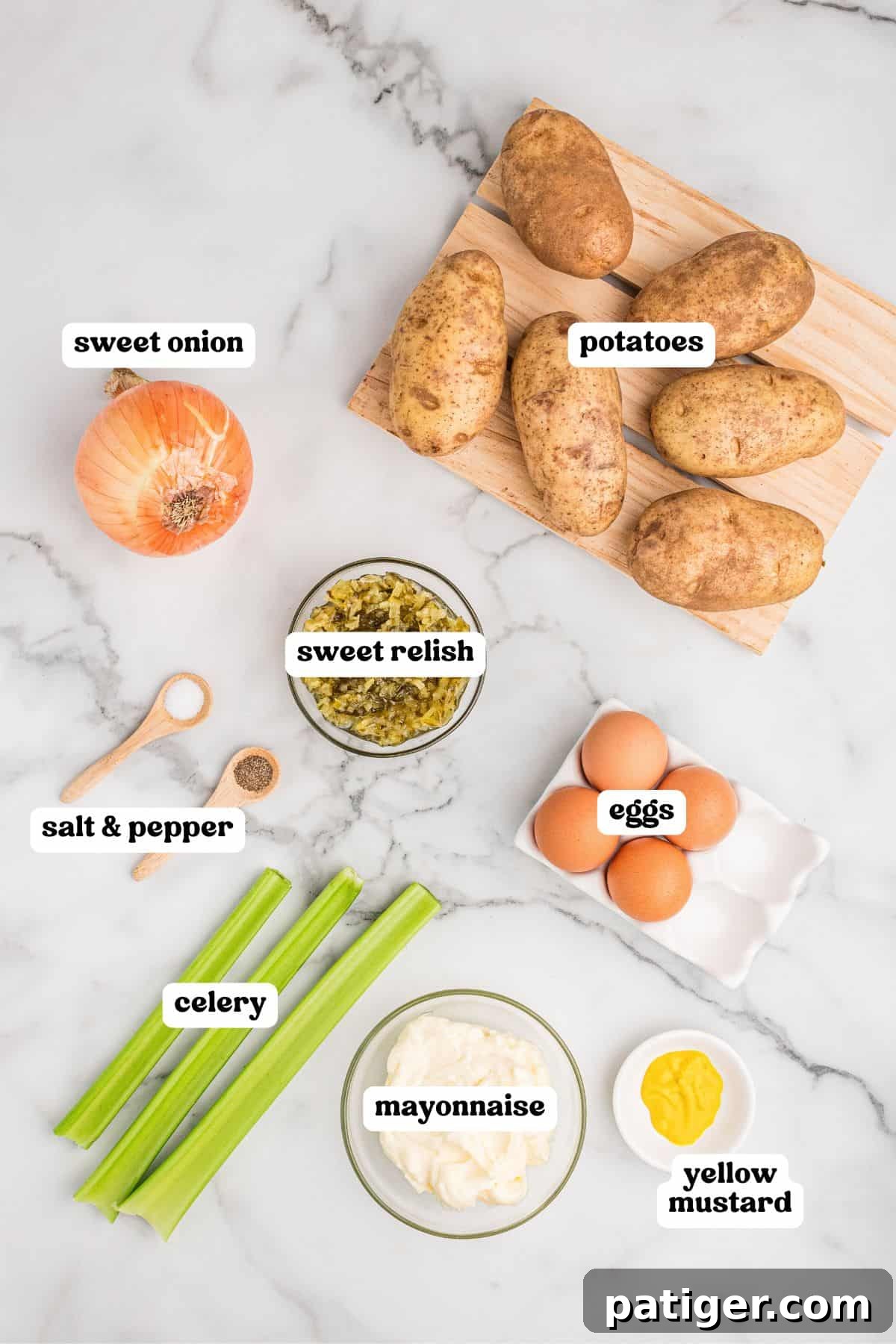 Ingredients for classic potato salad including potatoes, sweet onion, celery, sweet relish, mayonnaise, yellow mustard, hard-boiled eggs, salt, and pepper, arranged on a rustic wooden board.