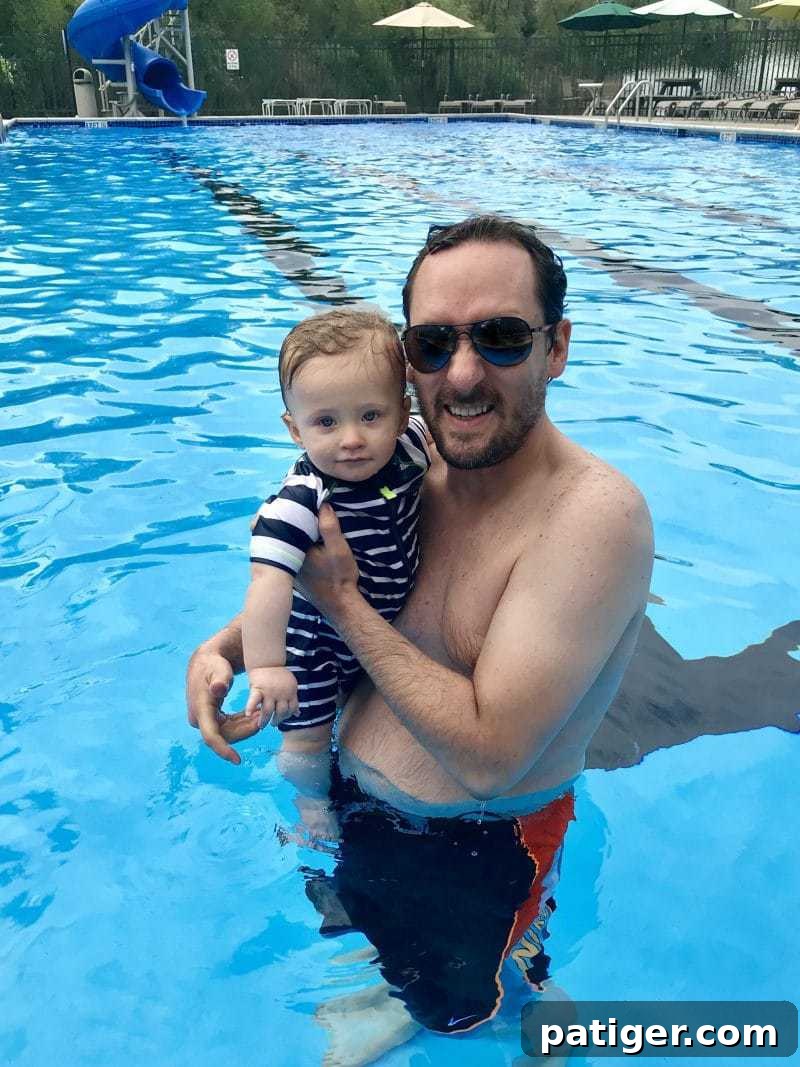 8 Heartwarming Ways to Celebrate a New Dad's First Father's Day 8 Dad and son enjoying a splash in the swimming pool together