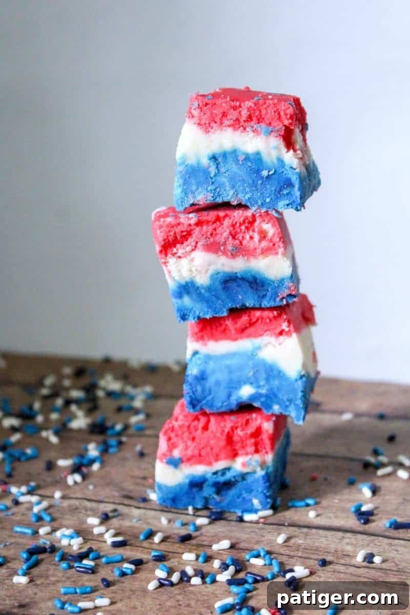 Close-up of the finished Red, White, and Blue Fudge, showcasing its distinct colored layers. This easy marshmallow creme fudge is ideal for patriotic events.
