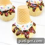 A square image of a finished melting ice cream cone cupcake, serving as a prompt to share creations