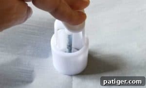 Celestial Soaks: Crafting Bath Bombs with a Moon Cake Press 13 Place moon press as shown in photo. Press down firmly once or twice to further pack in the mixture.