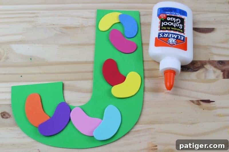 Glue the colorful jelly beans onto the letter J