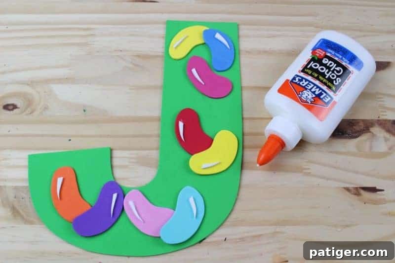 Add white details and highlights to the jelly beans for a realistic look