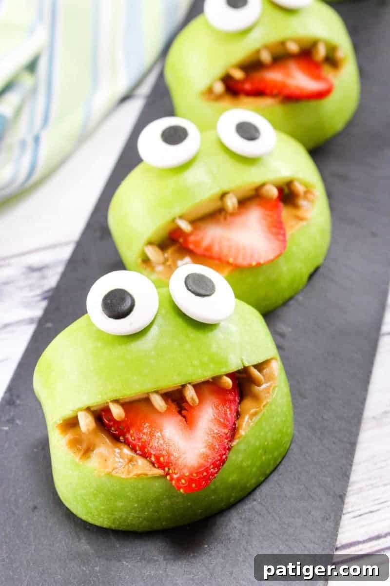 Made with apples, peanut butter, strawberries, sunflower seeds, and edible eyes, these Monster Apple Bites are a fun snack packed with nutrition! Perfect for Halloween or whenever you are looking for a fun snack idea for the kids.