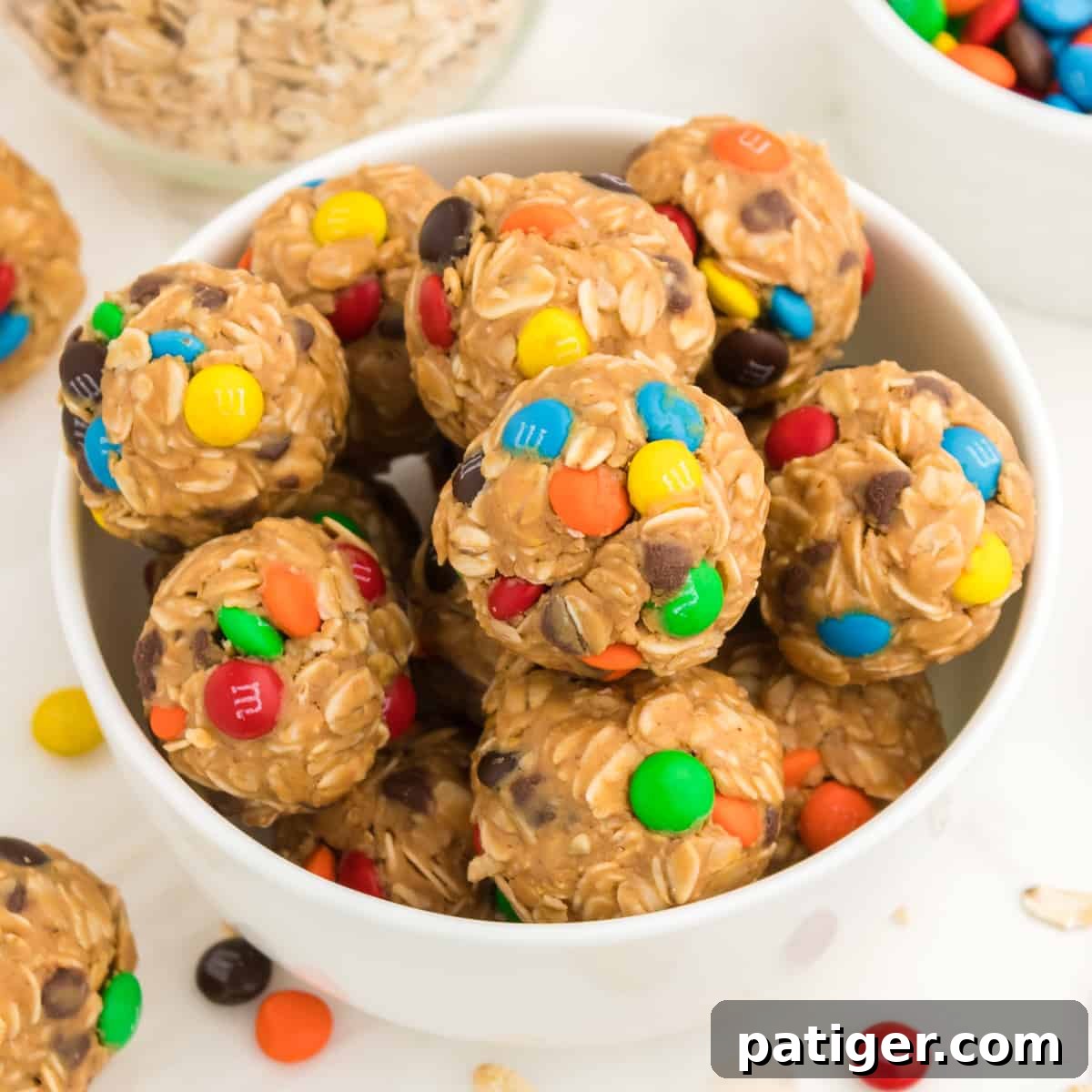 Monster Energy Balls with oats, mini M&Ms, chocolate chips, peanut butter, and honey.
