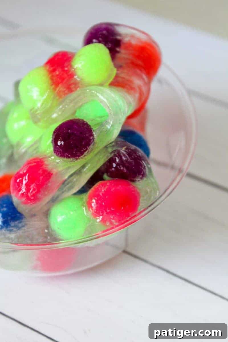 A finished batch of colorful pom pom slime, ready for play.