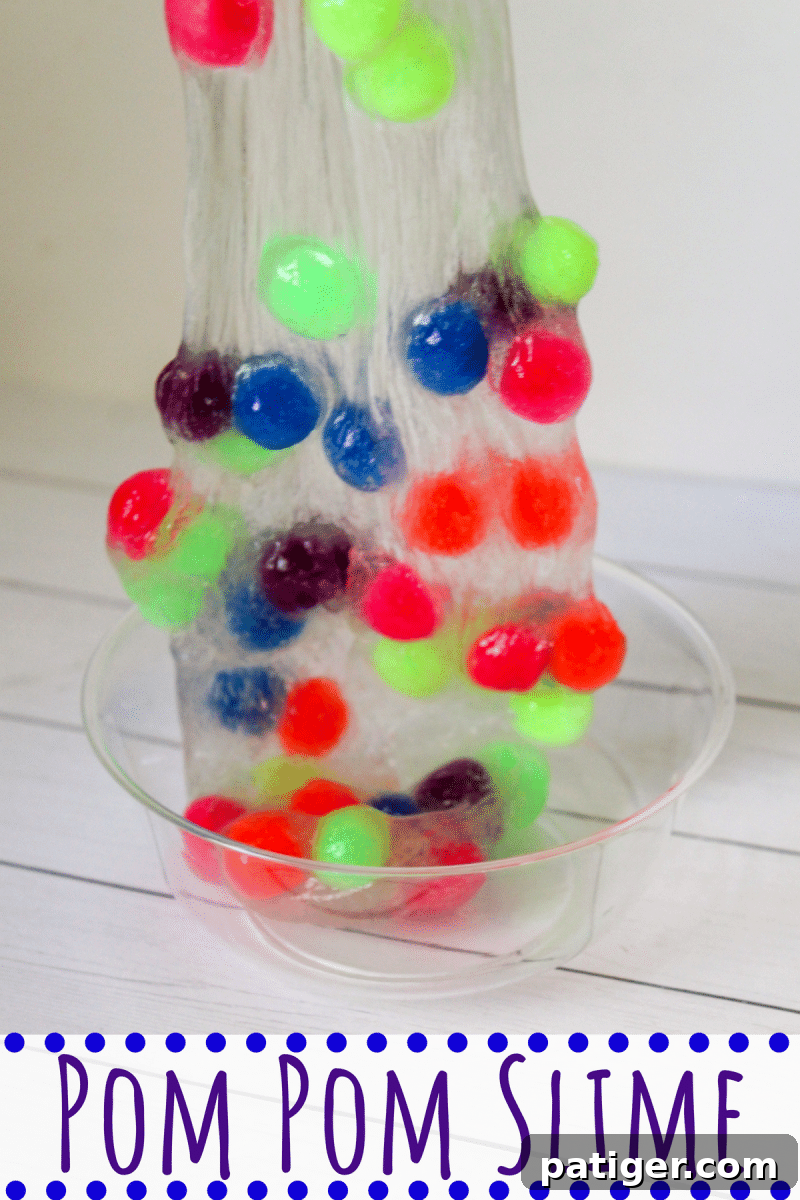Colorful pom pom slime with clear base, perfect for sensory play.