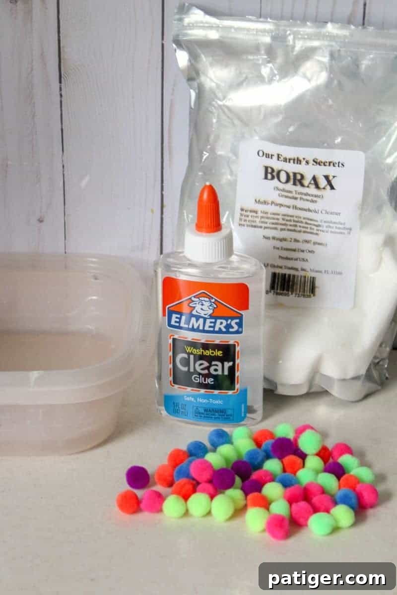 Supplies laid out for making pom pom slime.