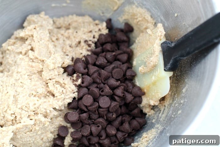 Cookie Dough Pumpkin Pops in the making, showing chocolate chips