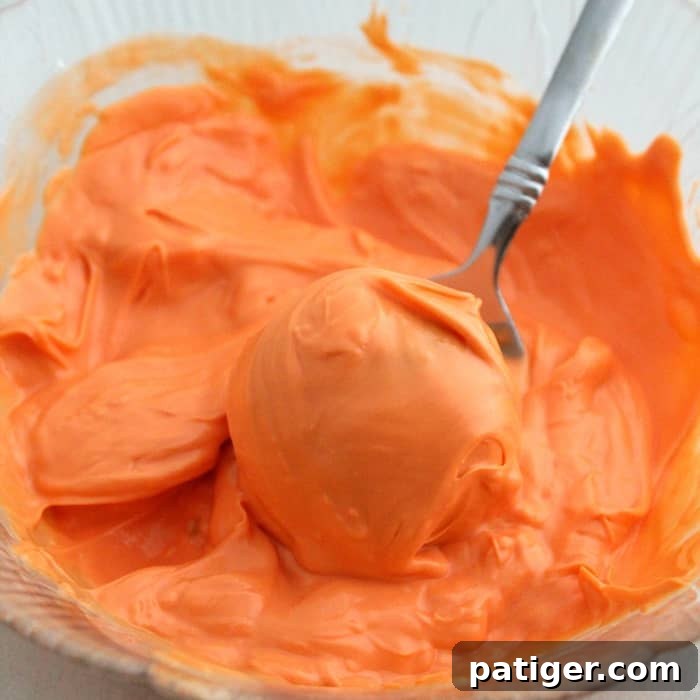 Melted Orange Candy Melts for Pumpkin Cookie Dough Pops