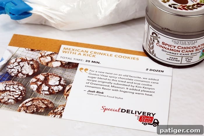 A photograph of the Taste of Home Mexican Crinkle Cookies with a Kick Recipe Card. The card features a vibrant image of the finished cookies and clearly outlines the ingredients and step-by-step instructions, inspiring home bakers to create this unique spicy chocolate cinnamon cookie.