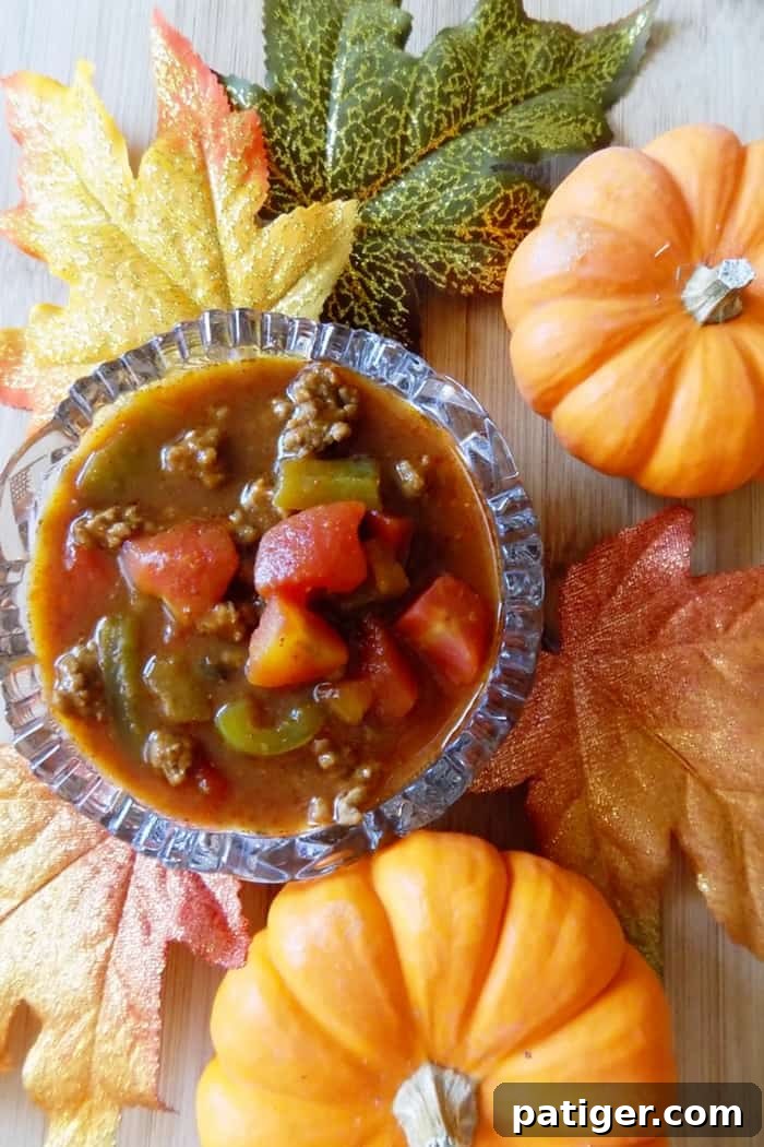 A savory Fall slow cooker Pumpkin chili recipe perfect for warming your bones up on a cool evening.