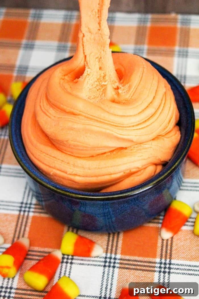 A bowl of freshly made, still warm candy corn slime, ready for children to play with