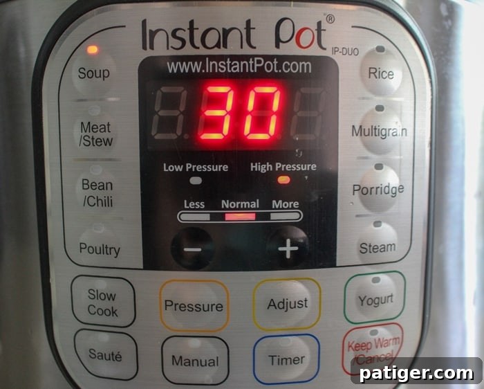 An Instant Pot set to the 'Soup' function, illustrating the ease and convenience of making potato soup in a pressure cooker.