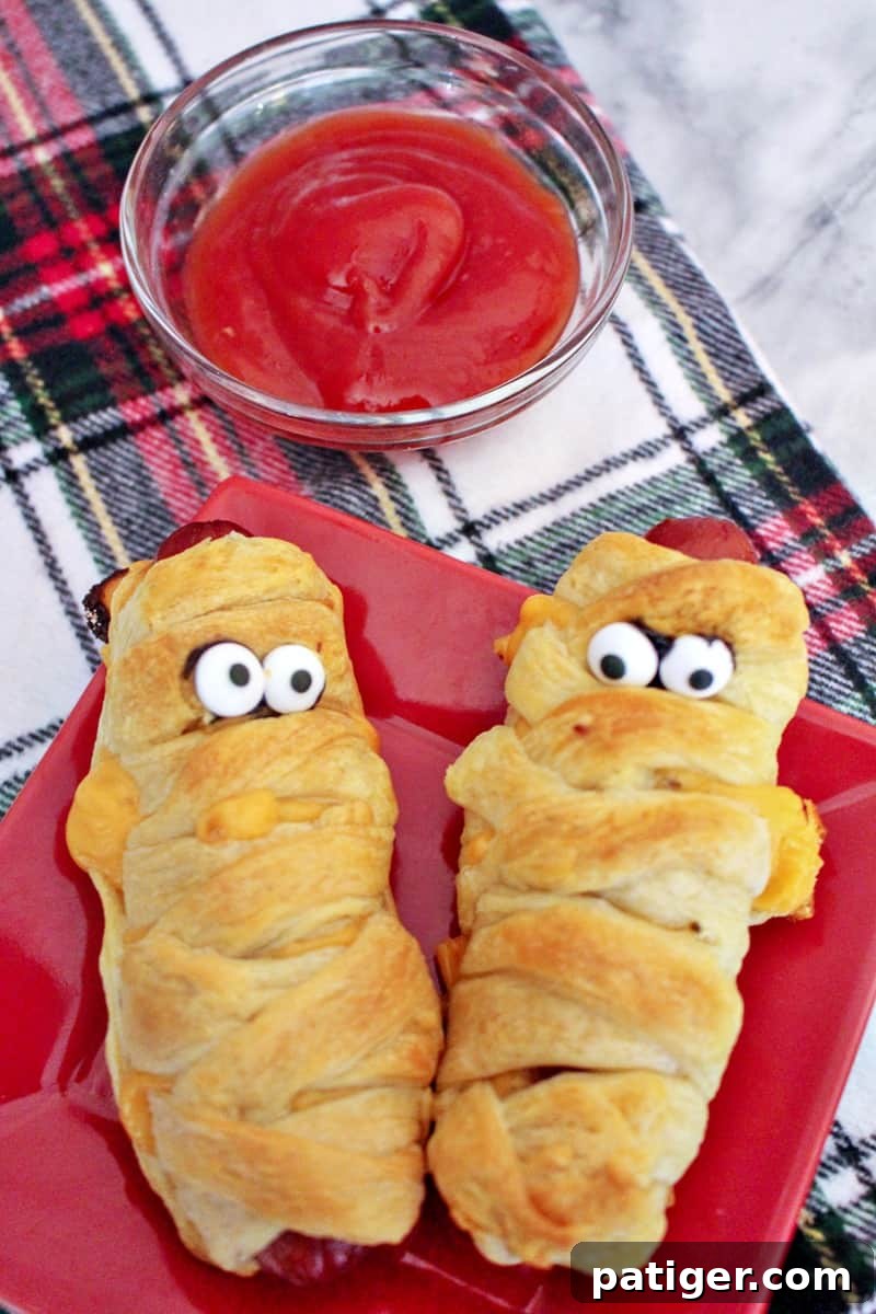 Mummy hot dogs are a fun Halloween dinner, perfect after a busy night of trick-or-treating. Plus, they are ridiculously easy to make using crescent rolls.