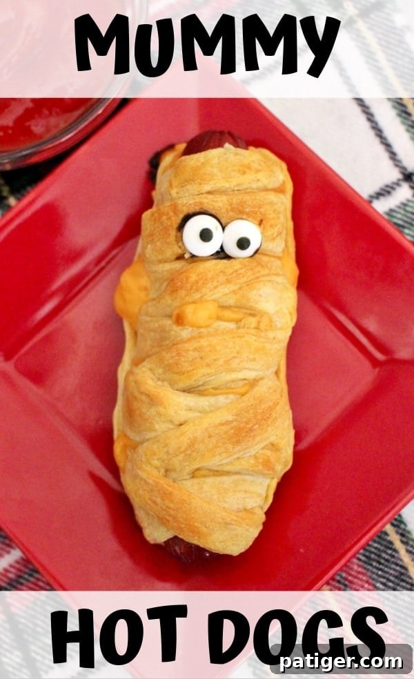 Mummy hot dogs are a fun #Halloween dinner, perfect after a busy night of trick-or-treating. Plus, they are ridiculously easy to make using crescent rolls. #HalloweenRecipes