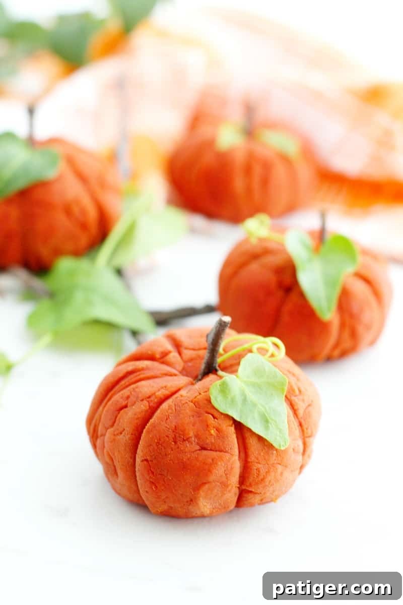 Sensory Pumpkin Spice Playdough 2 Children enjoying taste-safe pumpkin spice playdough for Fall sensory activities