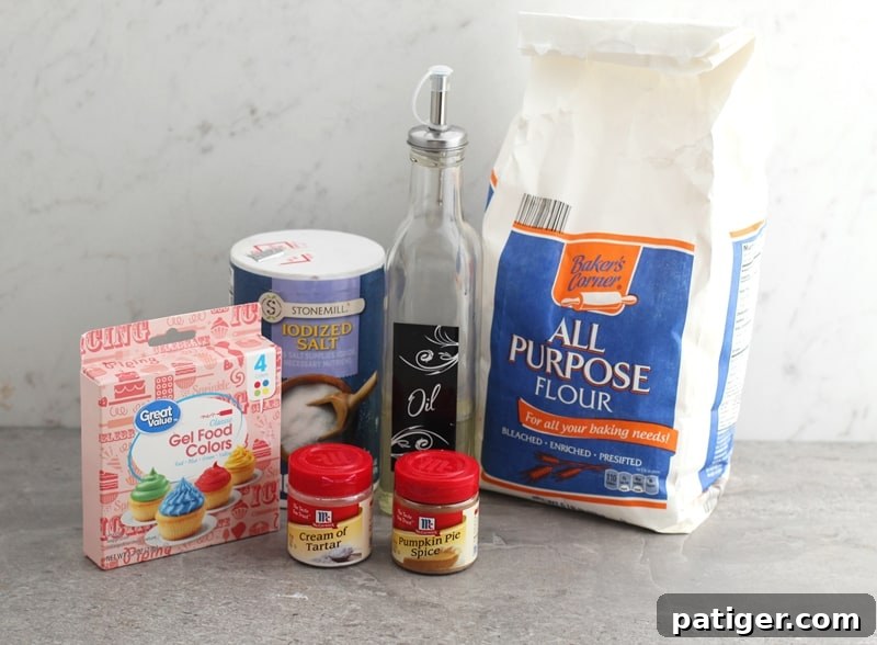 Sensory Pumpkin Spice Playdough 4 Ingredients laid out for homemade pumpkin spice playdough recipe