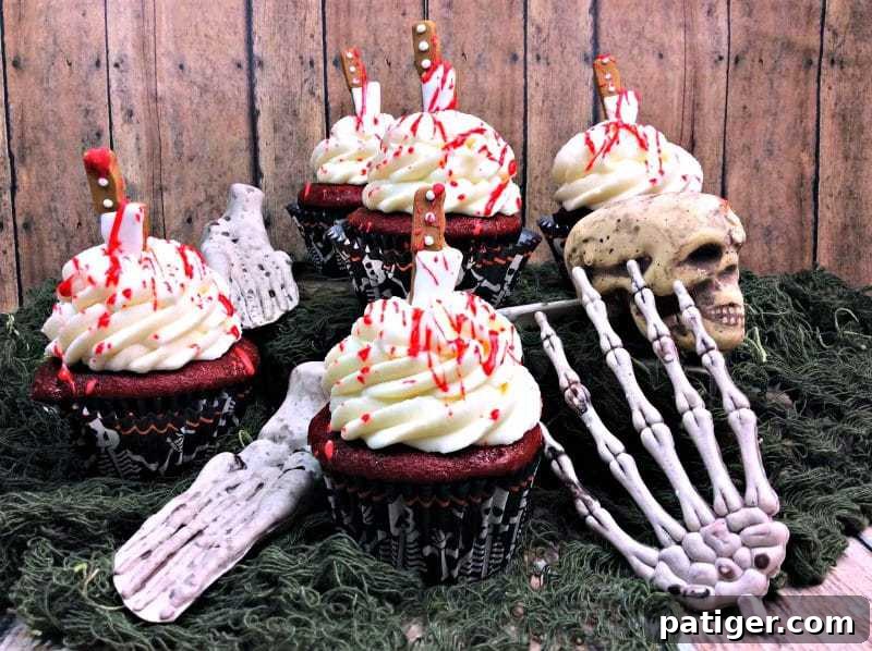 These creepy bloody cupcakes are stabbed with a knife and dripping with blood. A perfect dessert for your Halloween, Zombie, or Walking Dead party.