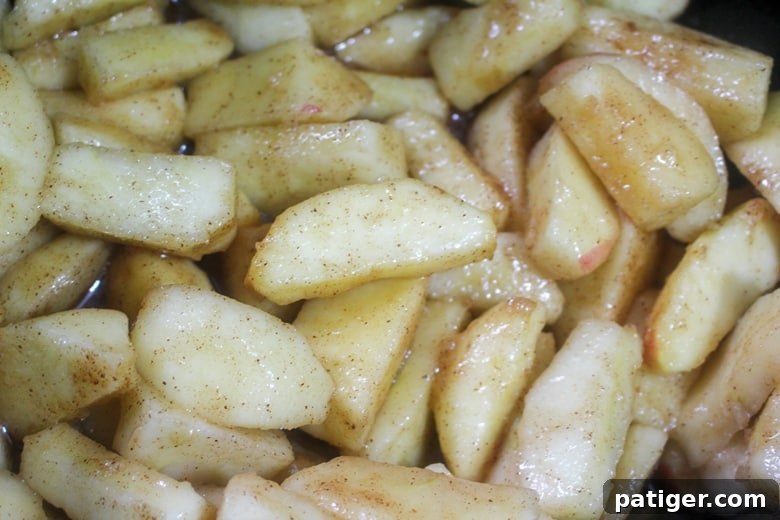 In process image of apples in crockpot