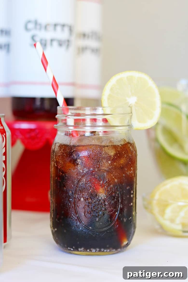 Level Up Your Party with a Custom Soda Bar 4 Close-up of a refreshing Diet Coke with a lemon slice, highlighting the simple elegance of customized beverages.