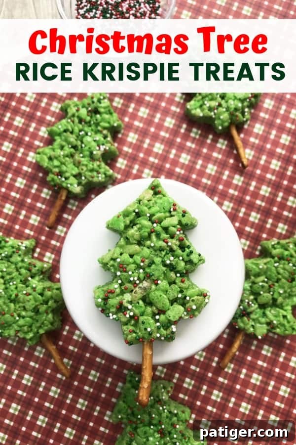 A beautifully arranged flat lay of green Christmas Tree Rice Krispie Treats with festive decorations, perfect for Pinterest.