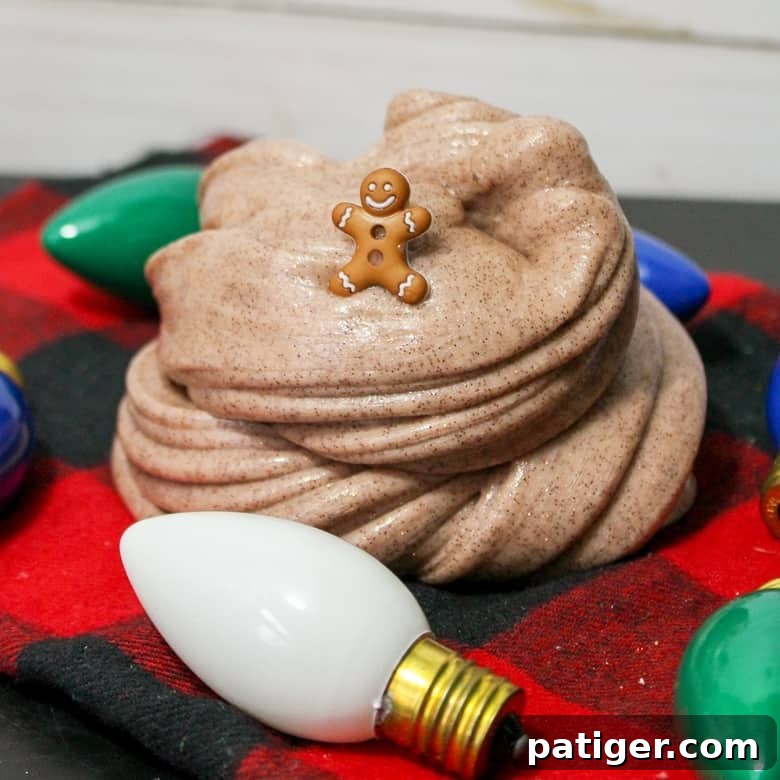 Spiced Gingerbread Slime 5 How to Make Gingerbread Slime, featuring a festive scene with gingerbread slime, a small gingerbread man toy, and Christmas decor, perfect for holiday crafting.