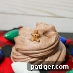 Spiced Gingerbread Slime 7 Gingerbread slime with small gingerbread man toy and Christmas decor, perfect for sharing your homemade craft.