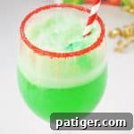 This small-batch Grinch Punch recipe made with Hawaiian Punch, Sprite, and lime sherbet is a perfect drink for the kids on Christmas.