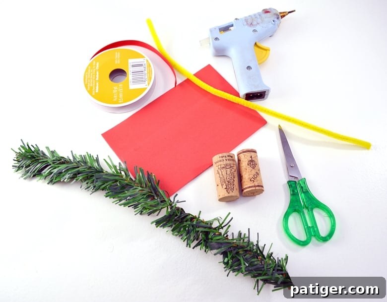 Handmade Wine Cork Candle Ornaments 3 All the necessary supplies laid out neatly on a crafting surface for making wine cork candle ornaments, including red foam, ribbon, pine garland, and glue.