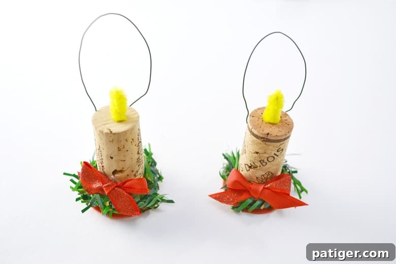 Handmade Wine Cork Candle Ornaments 9 A charming and rustic wine cork candle ornament, fully assembled and ready to hang, showcasing its festive details.