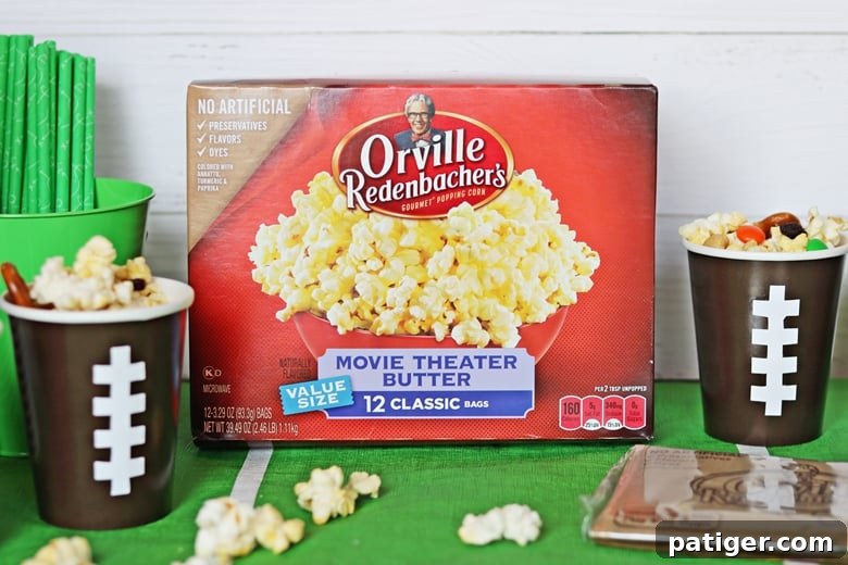 Tailgate Treat: Speedy Sweet and Salty Mix with Custom Football Holders 3 A no-bake sweet & salty snack mix made with popcorn, pretzels, raisins, chocolate, and peanuts. Served in DIY football cups, this easy snack mix is perfect for game day.