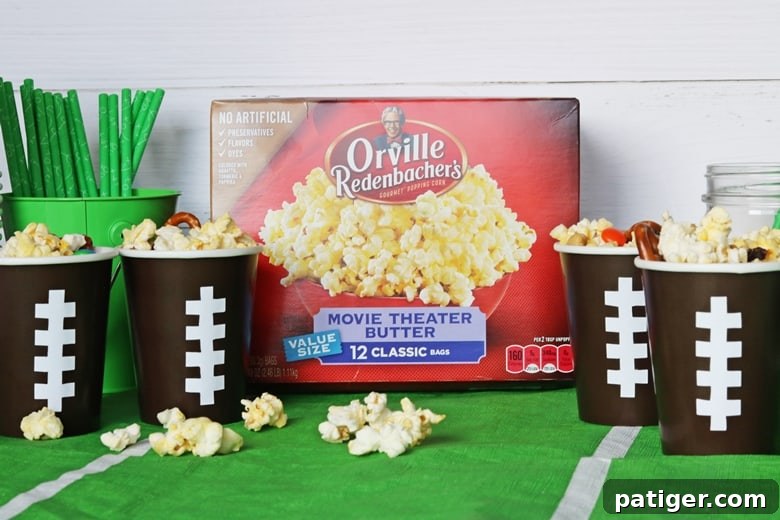 Tailgate Treat: Speedy Sweet and Salty Mix with Custom Football Holders 10 A no-bake sweet & salty snack mix made with popcorn, pretzels, raisins, chocolate, and peanuts. Served in DIY football cups, this easy snack mix is perfect for game day.