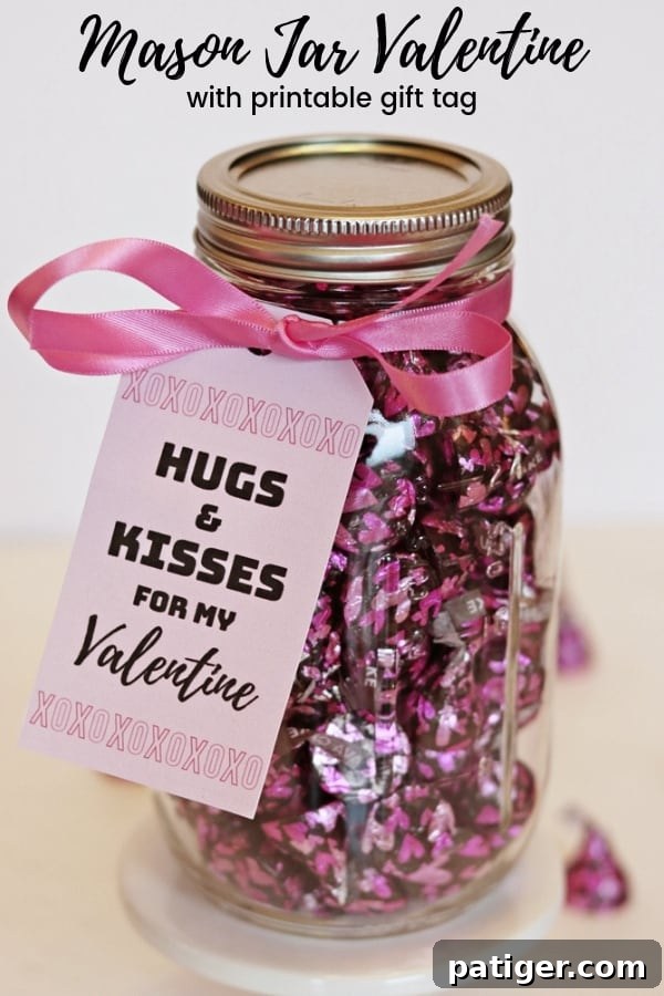 Pinterest-optimized image: "Hugs & Kisses" Mason Jar Valentine’s Day Gift Idea featuring Hershey Kisses and a printable tag.