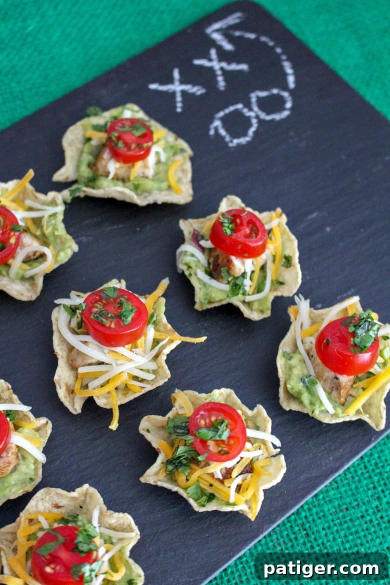 Quick Chicken Nacho Cups 4 Platter of easy chicken nacho bites, garnished with cilantro, ready for serving.
