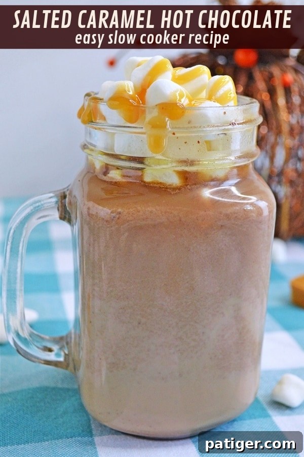 A beautifully styled image of a mug of slow cooker salted caramel hot chocolate, garnished with whipped cream and caramel drizzle. Highlighting its appeal for cozy moments.