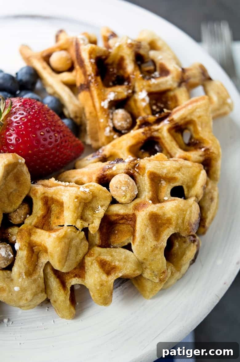 Beautifully plated Reese's Puffs cereal waffles, showcasing the rich peanut-buttery flavor and crispy texture, ready to be enjoyed as a delightful breakfast or brunch. The image perfectly captures the appeal of combining two breakfast favorites.