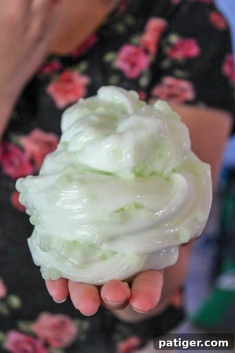 A vibrant batch of homemade glow in the dark slime infused with crunchy Perler beads, ready for playtime.