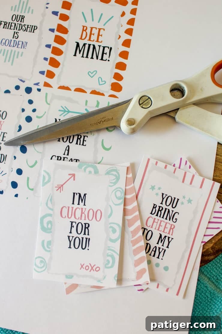Scissors cutting out the printable cereal valentine tags from cardstock