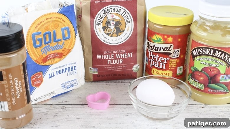 Fresh, wholesome ingredients for homemade dog treats laid out on a kitchen counter.
