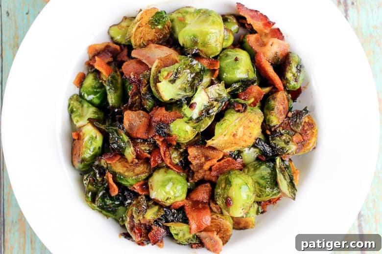 Bacon-Kissed Balsamic Brussels Sprouts 4 A serving of Brussels sprouts with crispy bacon pieces and a rich balsamic glaze, ready to be enjoyed.