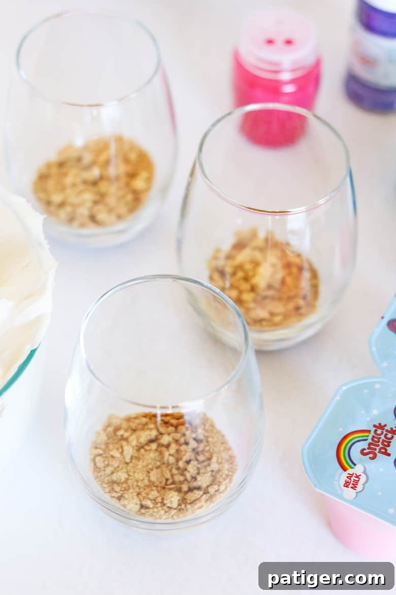 Magical Unicorn Swirl Parfaits 7 Graham cracker crumbs in bottom of parfait glasses