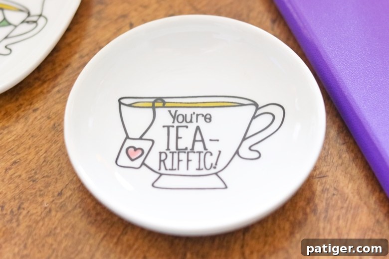 Craft Your Own Tea Lovers Basket 6 A charming tea bag holder declaring 'You're Tea-riffic!', a practical and witty addition to any tea lover's gift basket, keeping surfaces clean and adding a touch of humor.