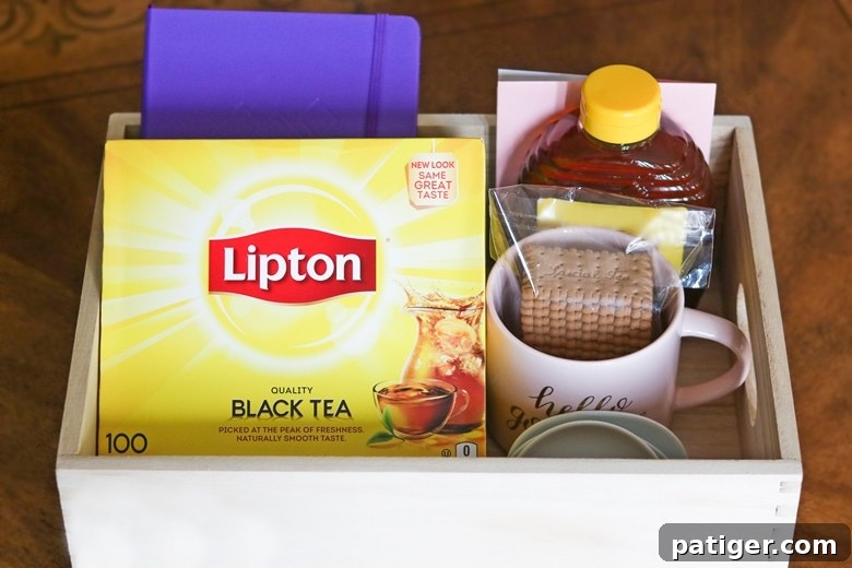 Craft Your Own Tea Lovers Basket 9 A beautifully arranged Tea Time Gift for Tea Lovers, presented in a stylish reusable storage crate, showcasing thoughtful items for a perfect tea experience.