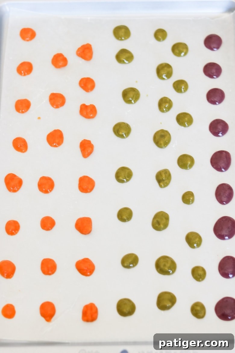 Frozen baby food dots for toddlers on a baking sheet