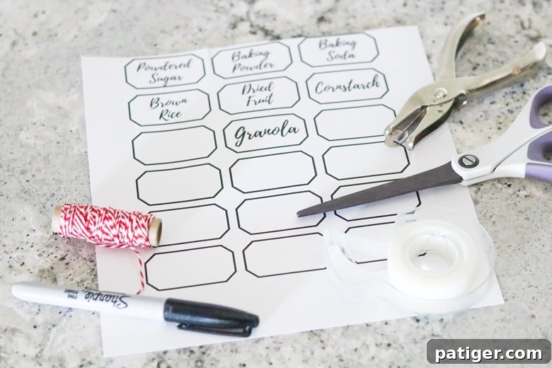 Printable Pantry Organization Labels, scissors, twine, hole punch and marker