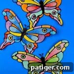 Stained Glass Style Butterfly Craft 9 How to make a faux stained-glass butterfly craft using cardstock, glue, watercolors, and the provided printable butterfly template.