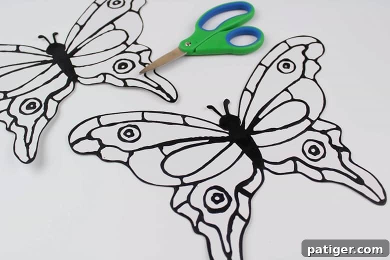 Stained Glass Style Butterfly Craft 6 Scissors and butterfly template on white cardstock