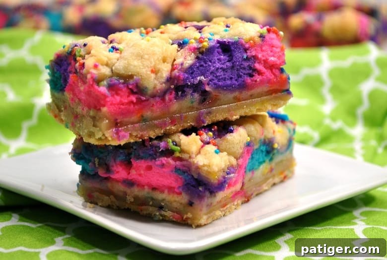 These unicorn bars are a delicious mix between sugar cookies and cheesecake and are decorated to give them a magical unicorn look.